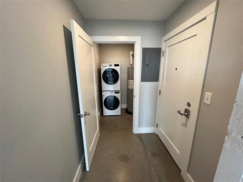 A laundry room with a washer and dryer.